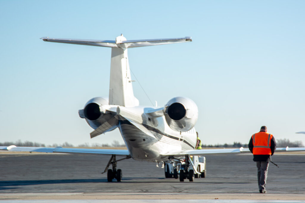 Learjet 60 being towed out of the hangar.