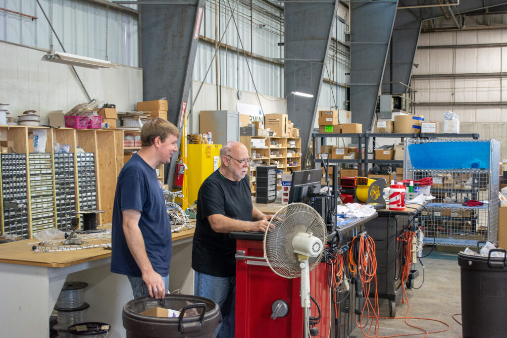 Butler Avionics employees at work in the hangar.